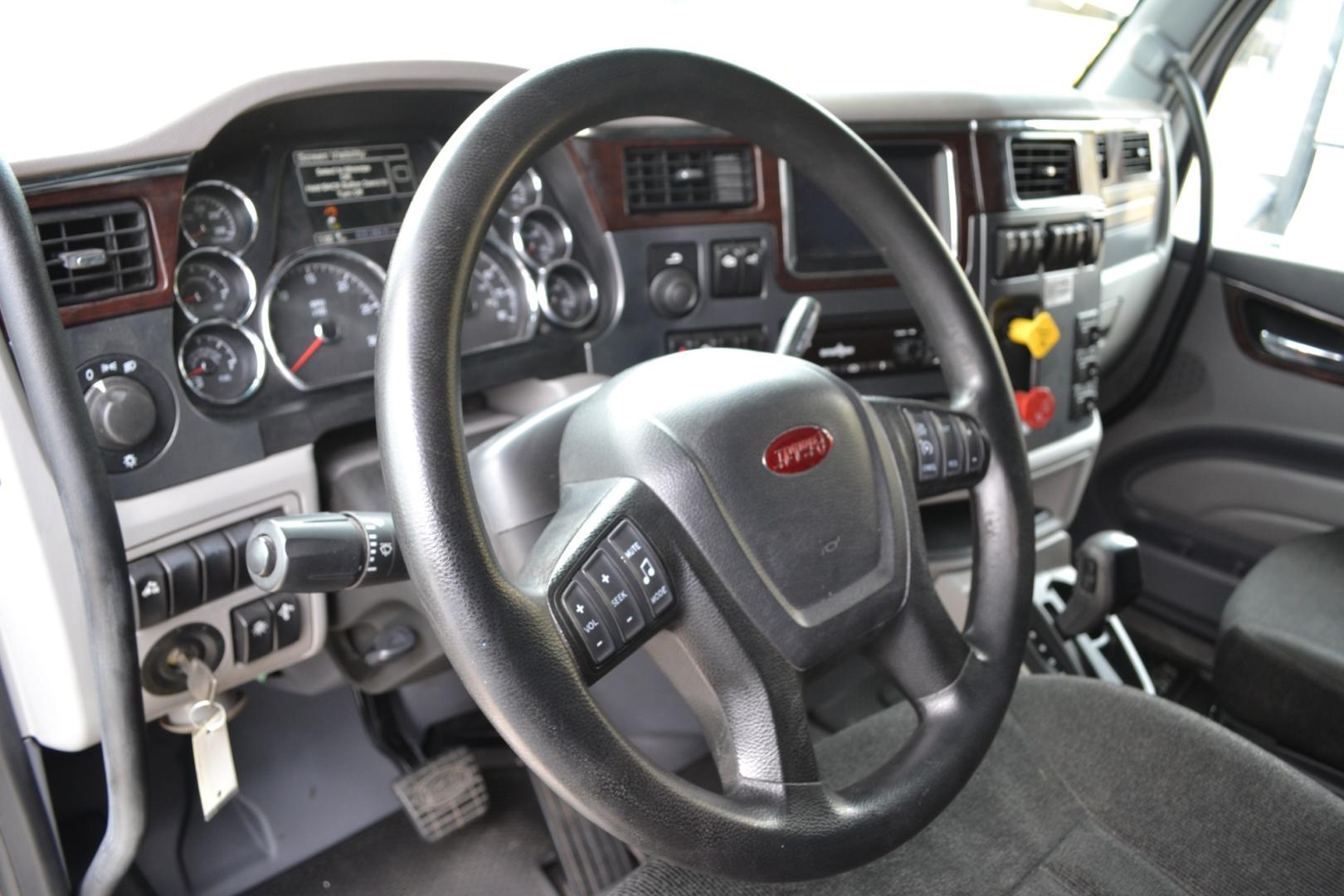 2017 WHITE /BLACK PETERBILT 579 EPIQ with an PACCAR MX13 12.9L 455HP engine, E.FULLER ADVANTAGE 10SPD AUTOMATED transmission, located at 9172 North Fwy, Houston, TX, 77037, (713) 910-6868, 29.887470, -95.411903 - 65" MID ROOF SLEEPER, DOUBLE BUNK, AIR SLIDE 5TH WHEEL, DIFF LOCK, AIR RIDE, ENGINE BRAKE, ELECTRIC APU, BUILT-IN NAVIGATION, MINI FRIDGE, ALUMINUM WHEELS, POWER WINDOWS , LOCKS, & MIRRORS, DUAL 135 GALLON FUEL TANKS, WB:230", RATIO: 2.64 - Photo#12